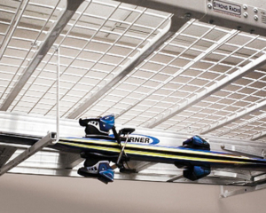 If you are short on floor space, look up. Most garages have open space above vehicle parking. This can give you lots of room for open shelving for totes and storage containers. What about those skis?  There's even a storage rack for those with these garage storage solutions.