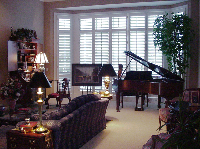 White Painted Shutters With Center Rod