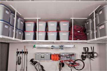 Overhead bins maximize garage storage space.
